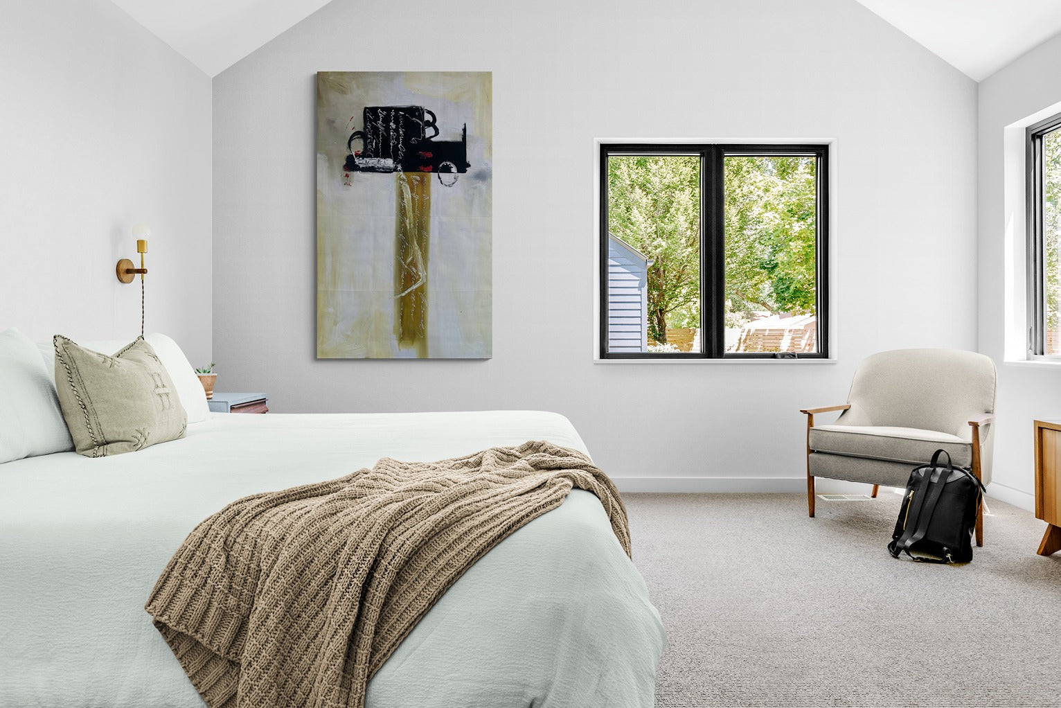 Large abstract original hand painted canvas wall art inside a confortable bedroom with a great garden view.