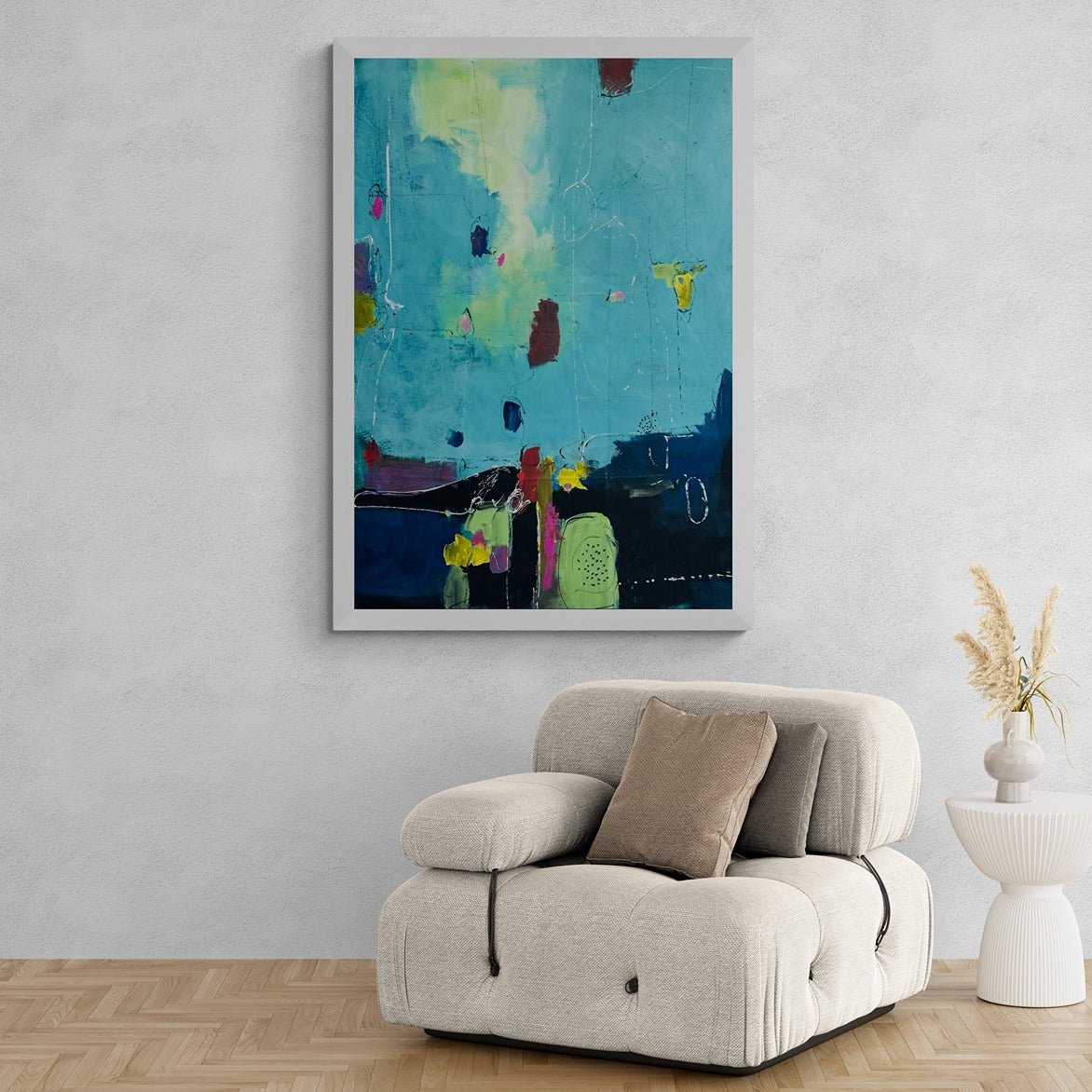 Large original hand-painted canvas abstract wall art accents a comfy modern armchair and side table, infusing artistic elegance into the contemporary decor.