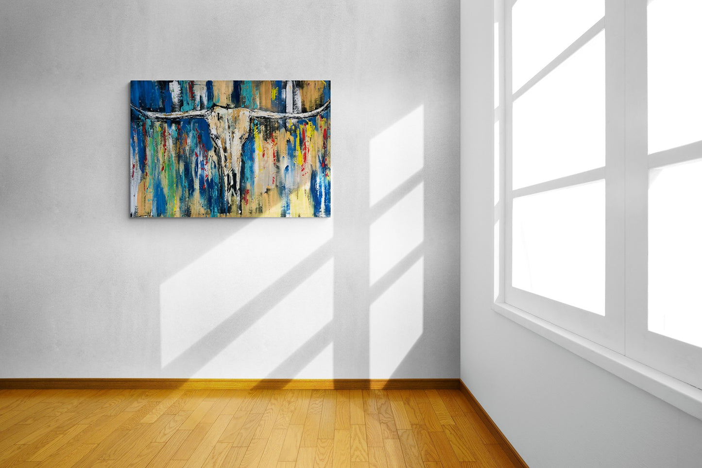 Large wall art of a longhorn being illuminated by the morning light.
