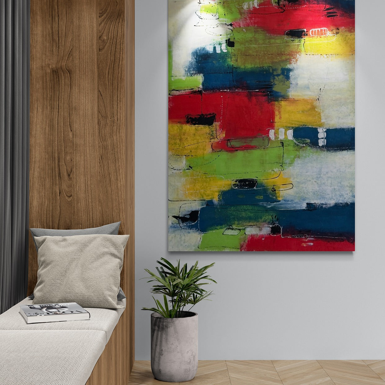 Colorful abstract original hand painted framed wall art next to a window seat and a plant