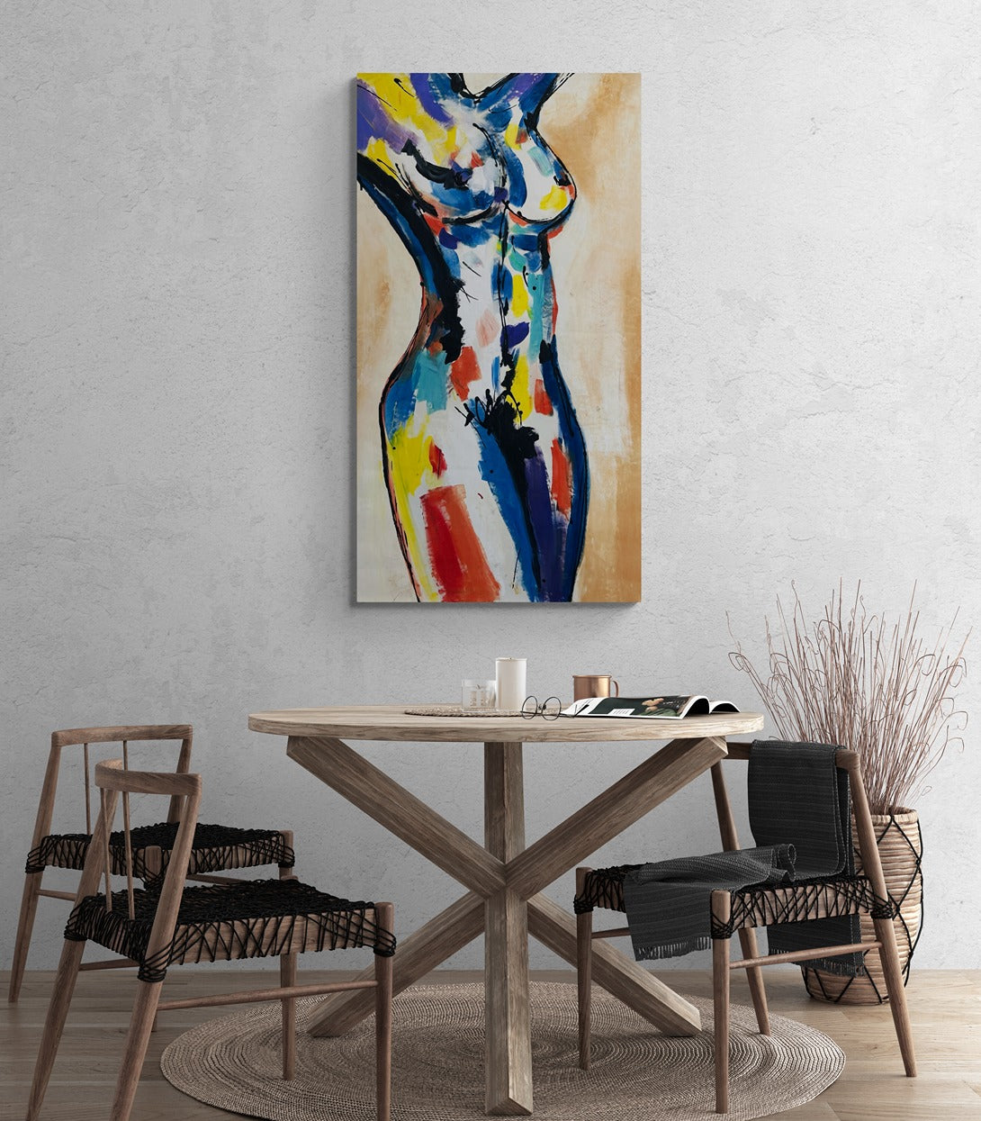 Original hand-painted abstract canvas wall art enhances the ambiance of a bohemian-themed dining room, adding artistic flair to the eclectic decor.