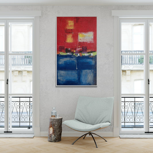 Original hand-painted abstract canvas wall art complements a comfy chair next to a log plinth, creating a cozy and artistic corner in the room.