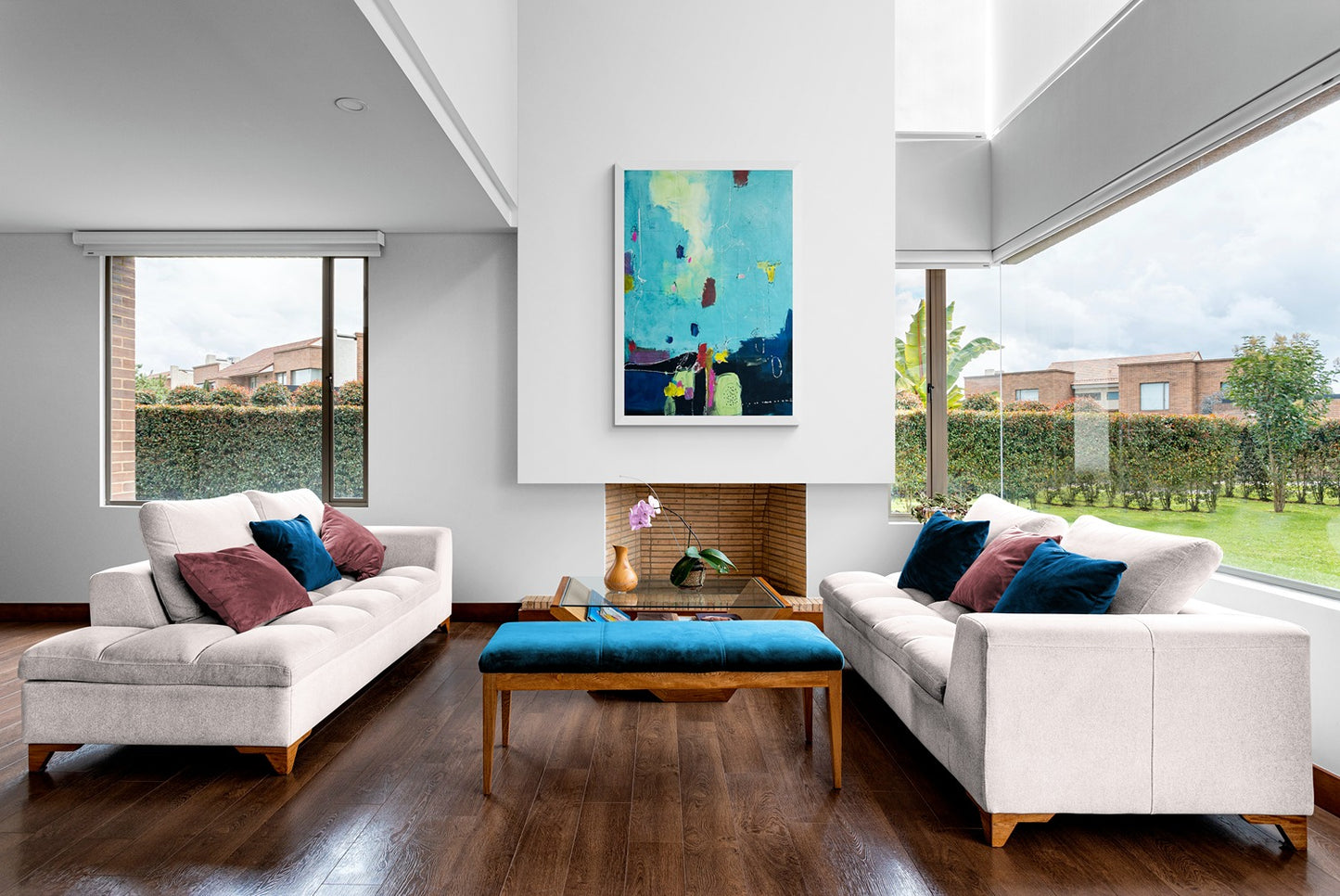 Rasavatta large wall art complements a comfy living room with serene garden views, adding elegance and tranquility to the space.