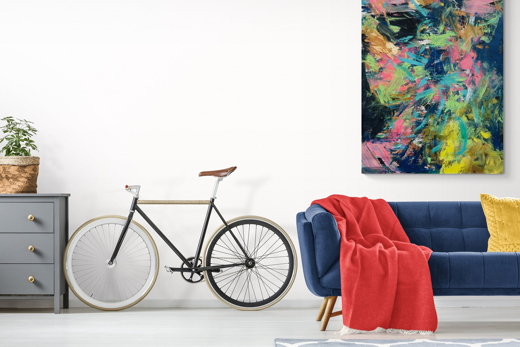 Beautiful, big abstract wall art in a living room designed for bike commuters.