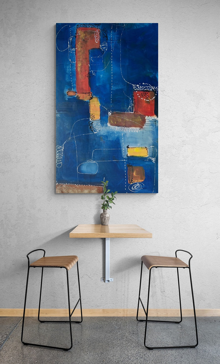 Cafe stools and table with large blue abstract canvas wall art.